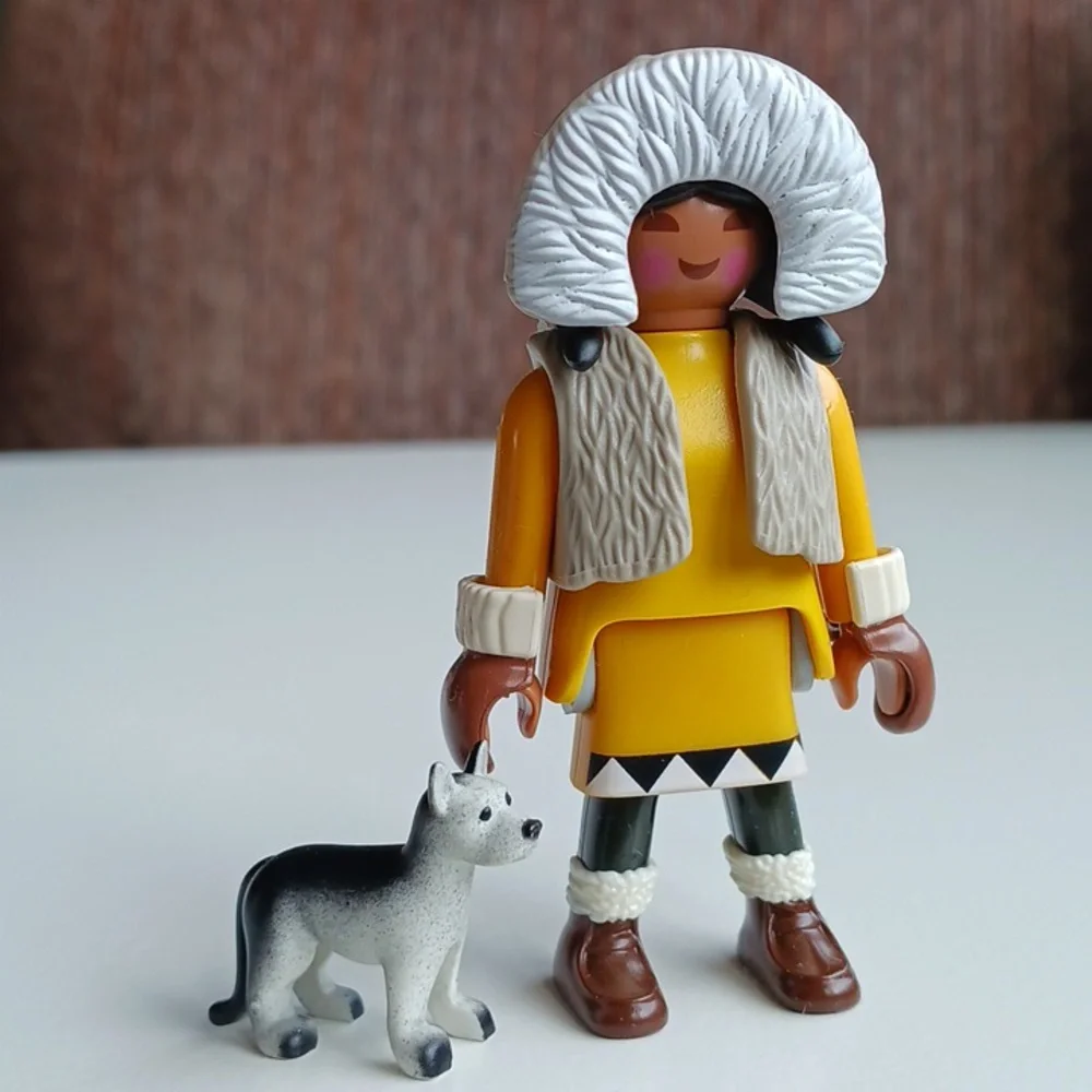 Inuit Eskimo girl with a husky